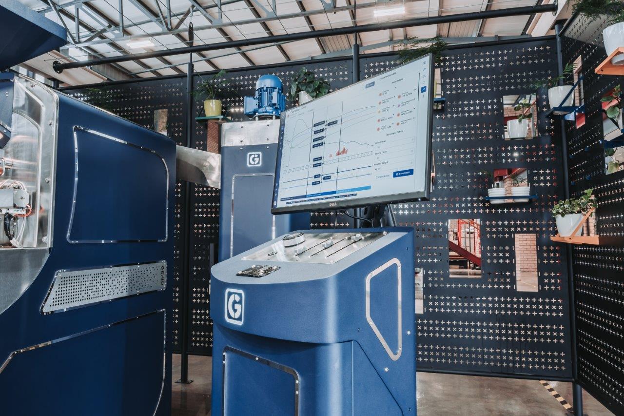 Control panel and touch screen interface of the Genio 6 Evolution Roaster, showcasing advanced AI-driven roasting controls and real-time data analytics.